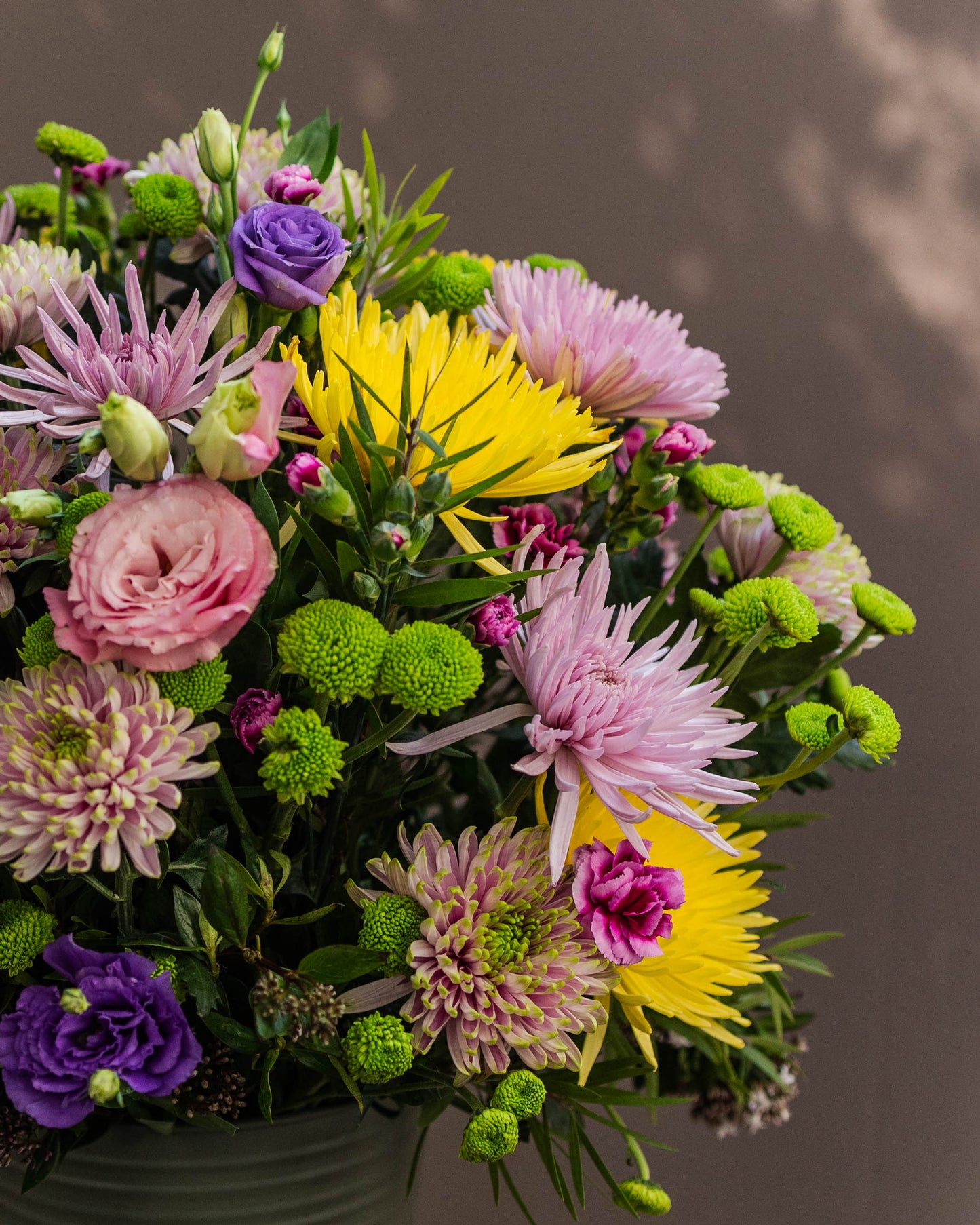 Stunning bouquet of disbud chrysanthemums and purple lisianthus – a vibrant floral arrangement symbolizing affection and love for a special one