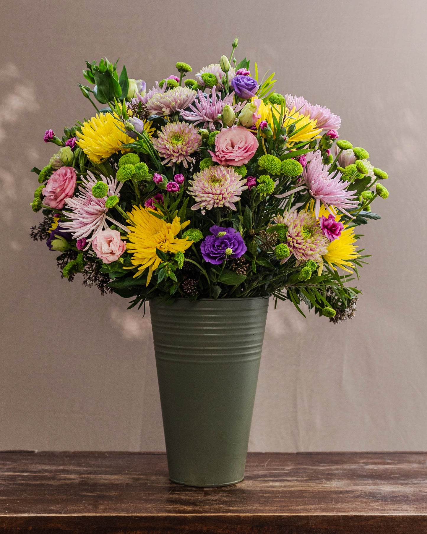 Stunning bouquet of disbud chrysanthemums and purple lisianthus – a vibrant floral arrangement symbolizing affection and love for a special one