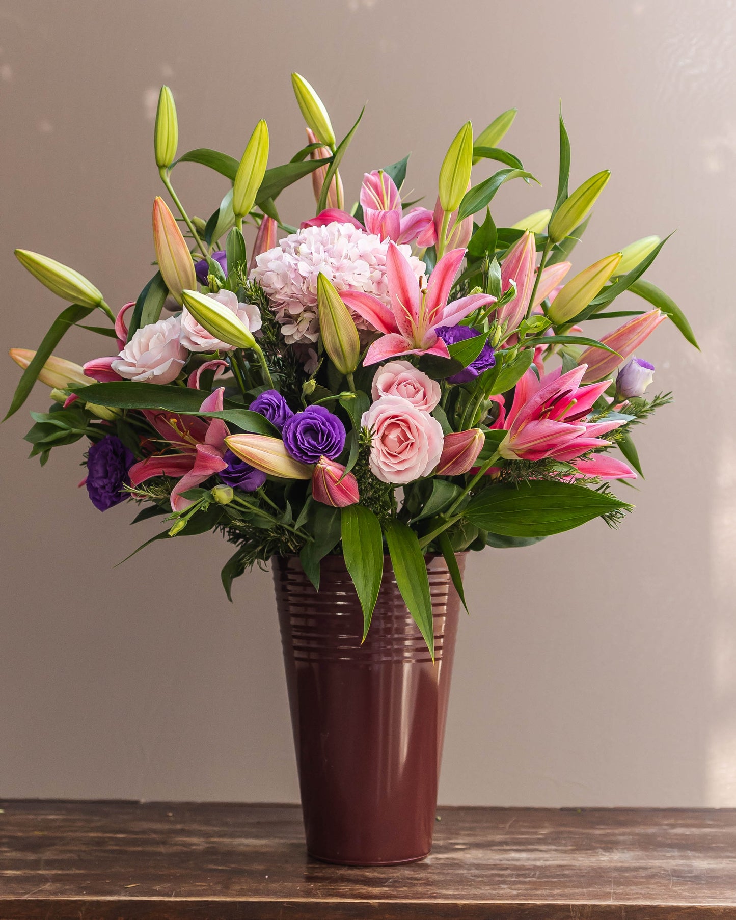 Elegant bouquet of pink fragrant Oriental lilies and pale pink hydrangeas with lush green fillers – a perfect blend of beauty and romance