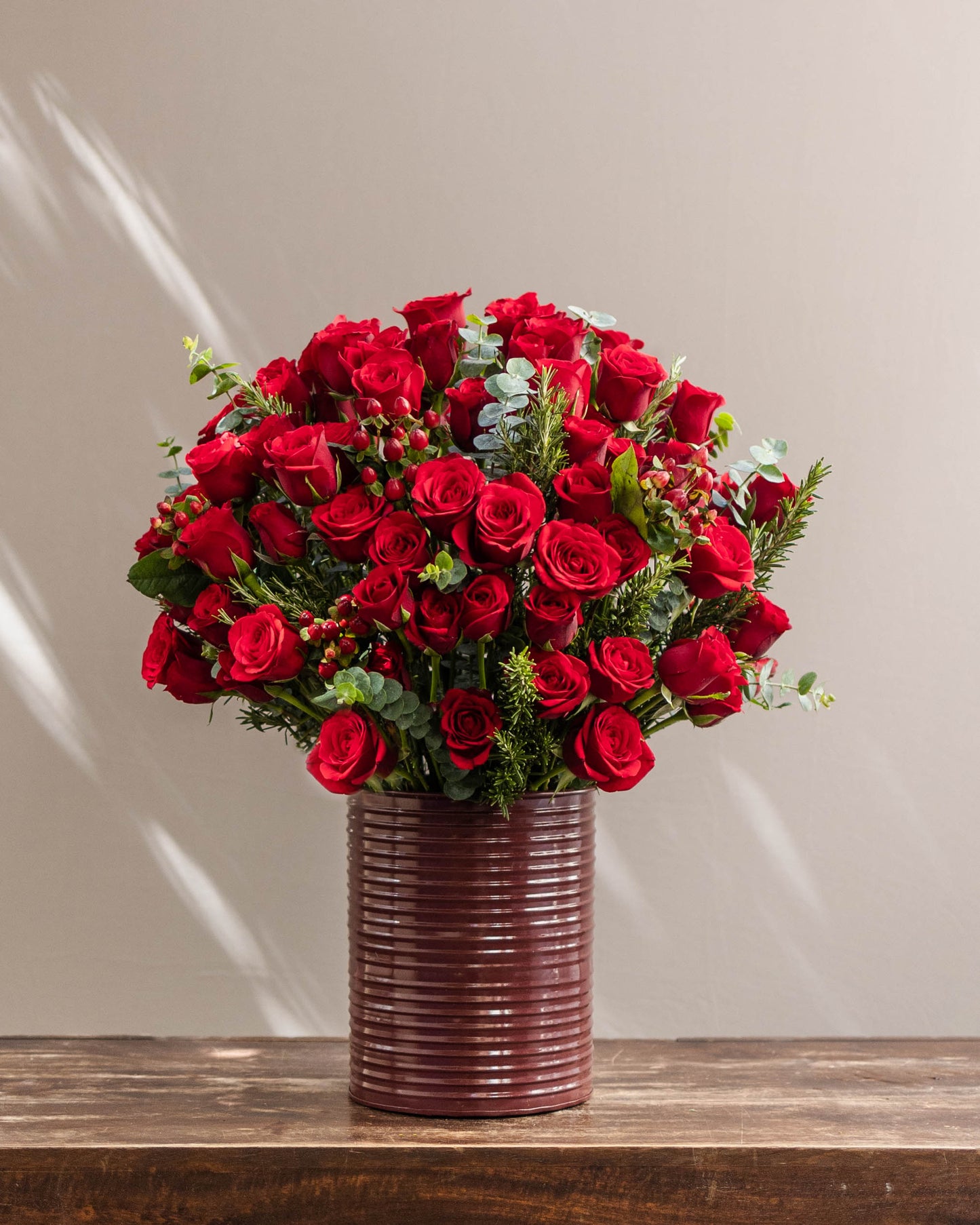 Dreaming of You – A stunning bouquet delivery of premium red roses arranged tightly in a vibrant custom tin with lush green fillers. Perfect for same-day florist delivery, online flower delivery in Bangalore, and special occasions like anniversaries and birthdays. Order this beautiful bouquet of flowers for home delivery, luxury flower arrangements, or as a high-end flower gift. Available for same-day bouquet delivery near you