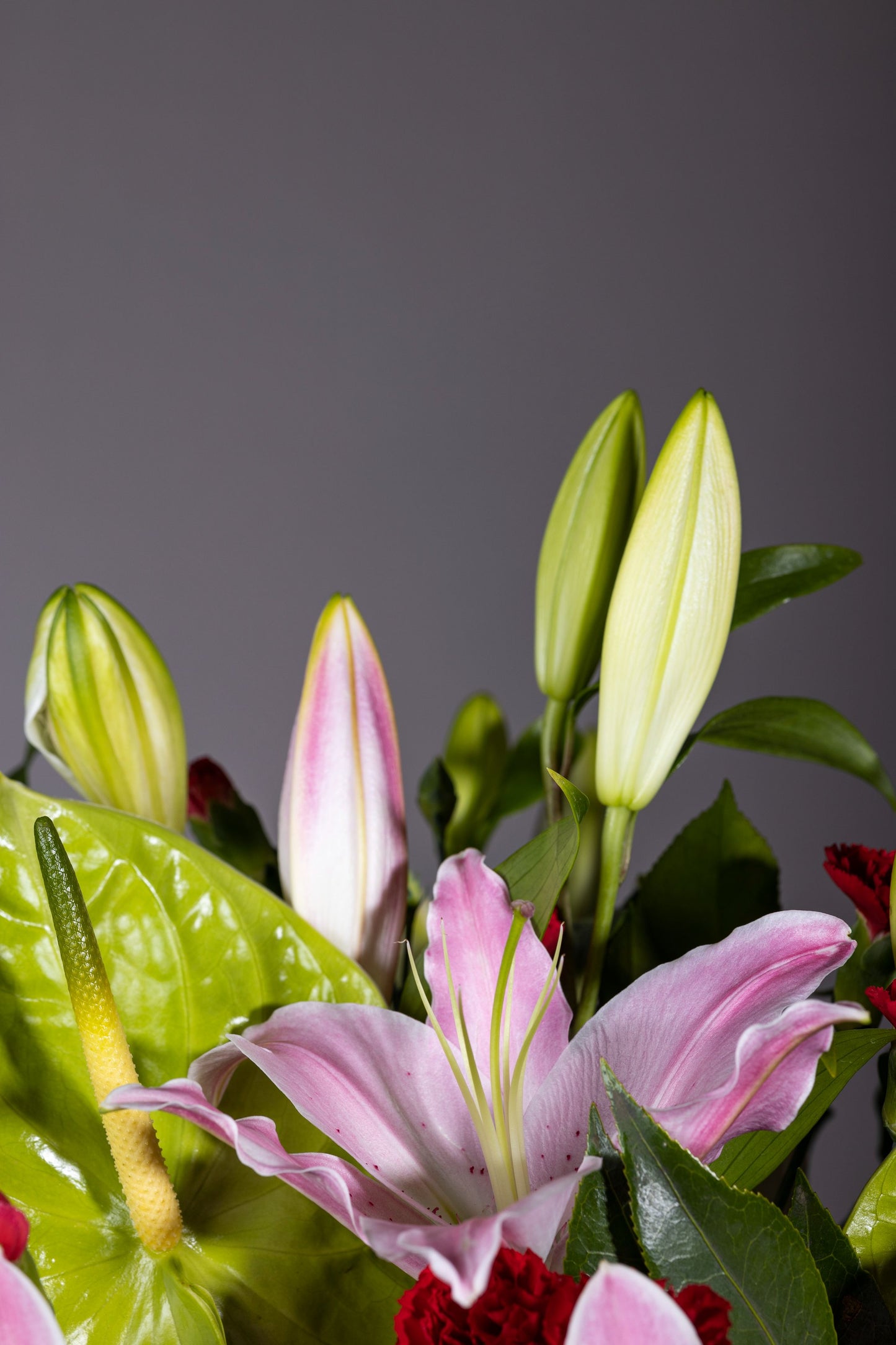 Charming Pinks - Elegant long and low centerpiece with aromatic Oriental Lilies, Spray Carnation, and Eustoma flowers in a glass container | Flower delivery in Bengaluru | Buy flower bouquets online Bengaluru | Same-day flower delivery Bengaluru | Online florist Bengaluru | Order flowers online Bengaluru | Luxury flower bouquet in Bengaluru