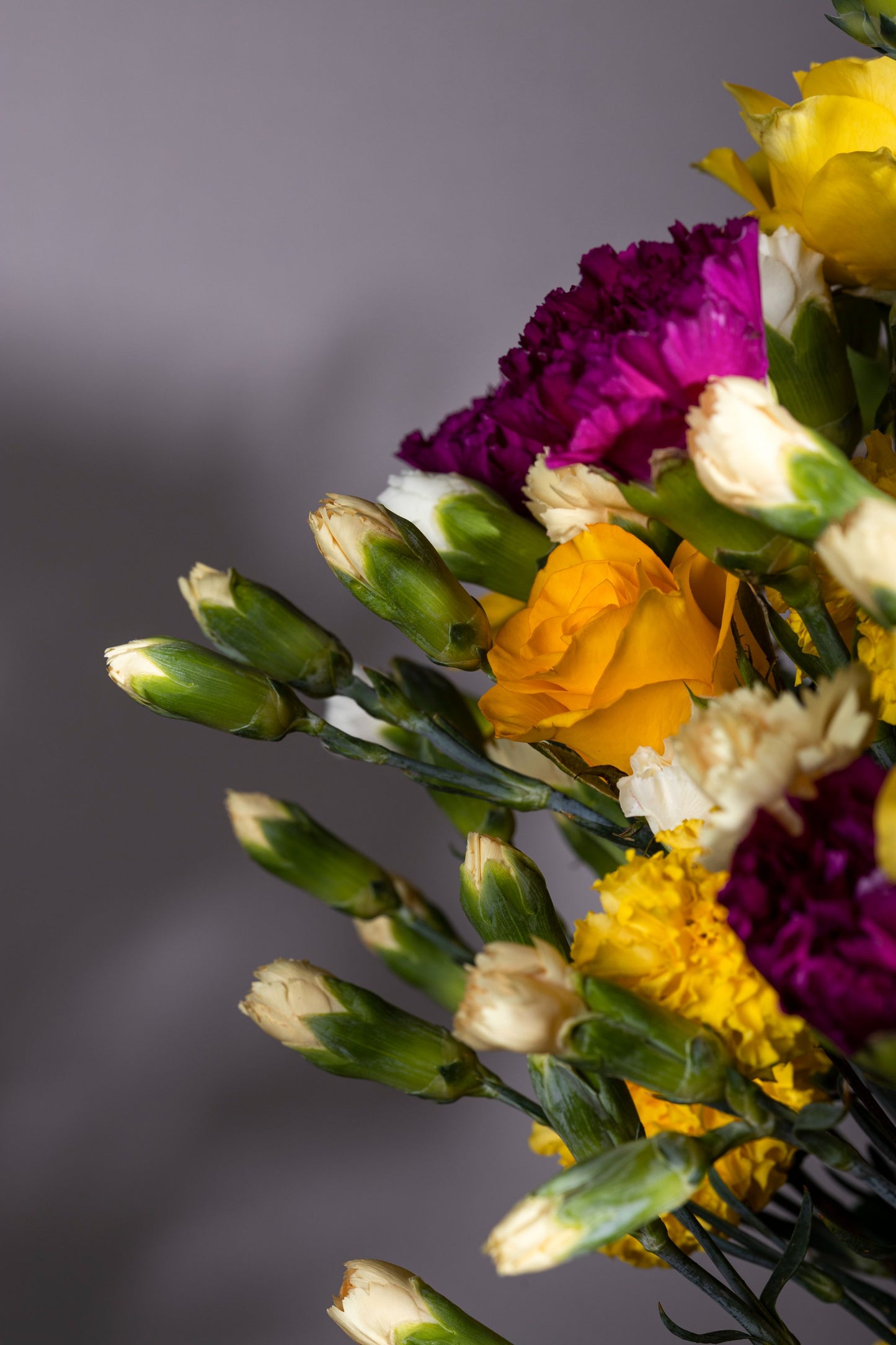 SOFT POWER | Beautiful yellow Roses, Purple Carnation stems, and White Spray Carnation stems in a pickle jar – Flower delivery in Bengaluru, Buy flower bouquets online Bengaluru, Same-day flower delivery Bengaluru, Online florist Bengaluru, Order flowers online Bengaluru, Luxury flower bouquet in Bengaluru