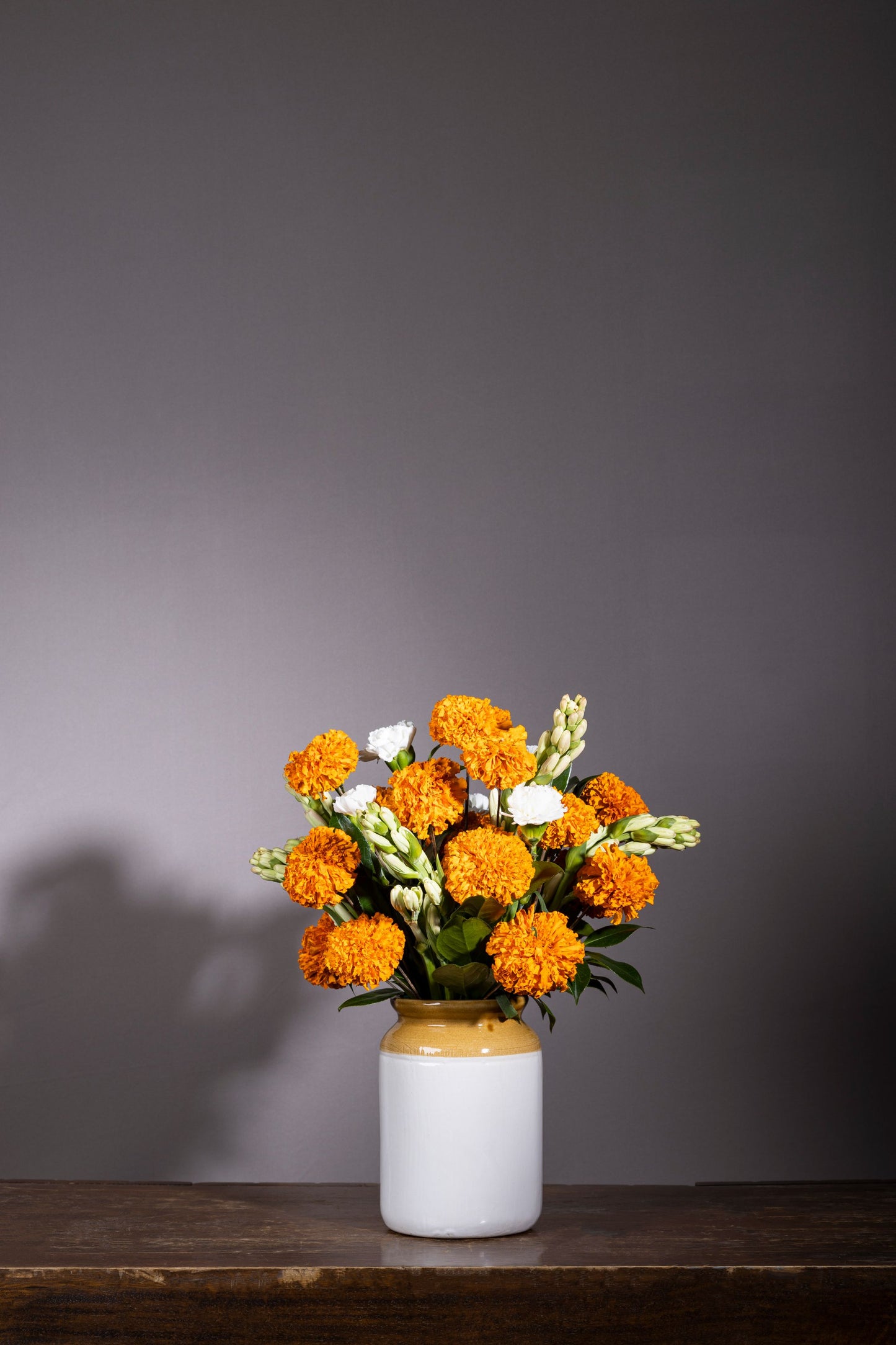 JAR OF JOY | Big orange Marigold and Tuberose bouquet in a pickle jar | Flower delivery in Bengaluru | Buy flower bouquets online Bengaluru | Same-day flower delivery Bengaluru | Online florist Bengaluru | Order flowers online Bengaluru | Luxury flower bouquet in Bengaluru