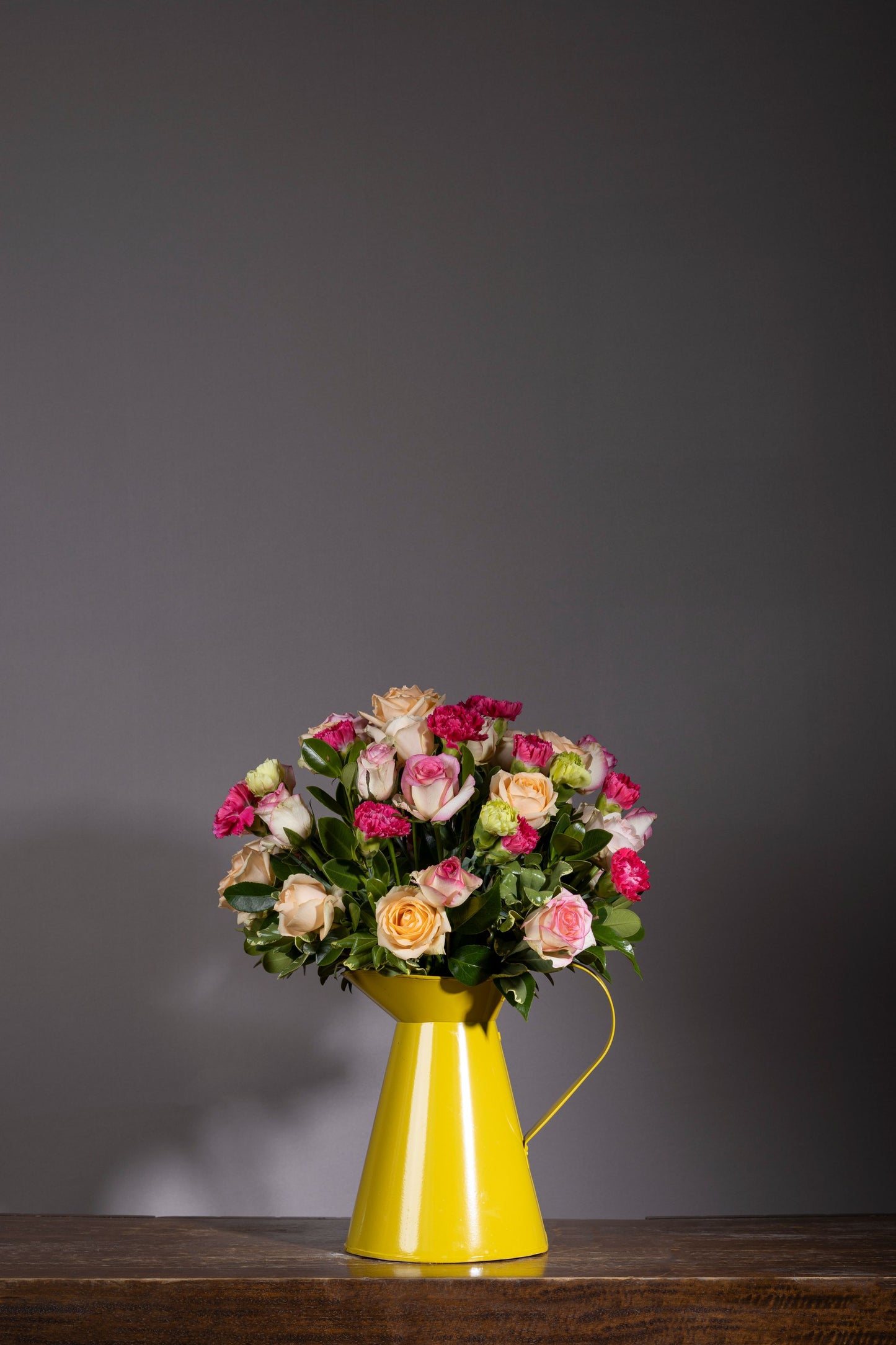 MELLOW bouquet | Dark Carnation stems and pastel Roses in lemony yellow metal can | Flower delivery in Bengaluru | Buy flower bouquets online Bengaluru | Same-day flower delivery Bengaluru | Online florist Bengaluru | Order flowers online Bengaluru | Luxury flower bouquet in Bengaluru