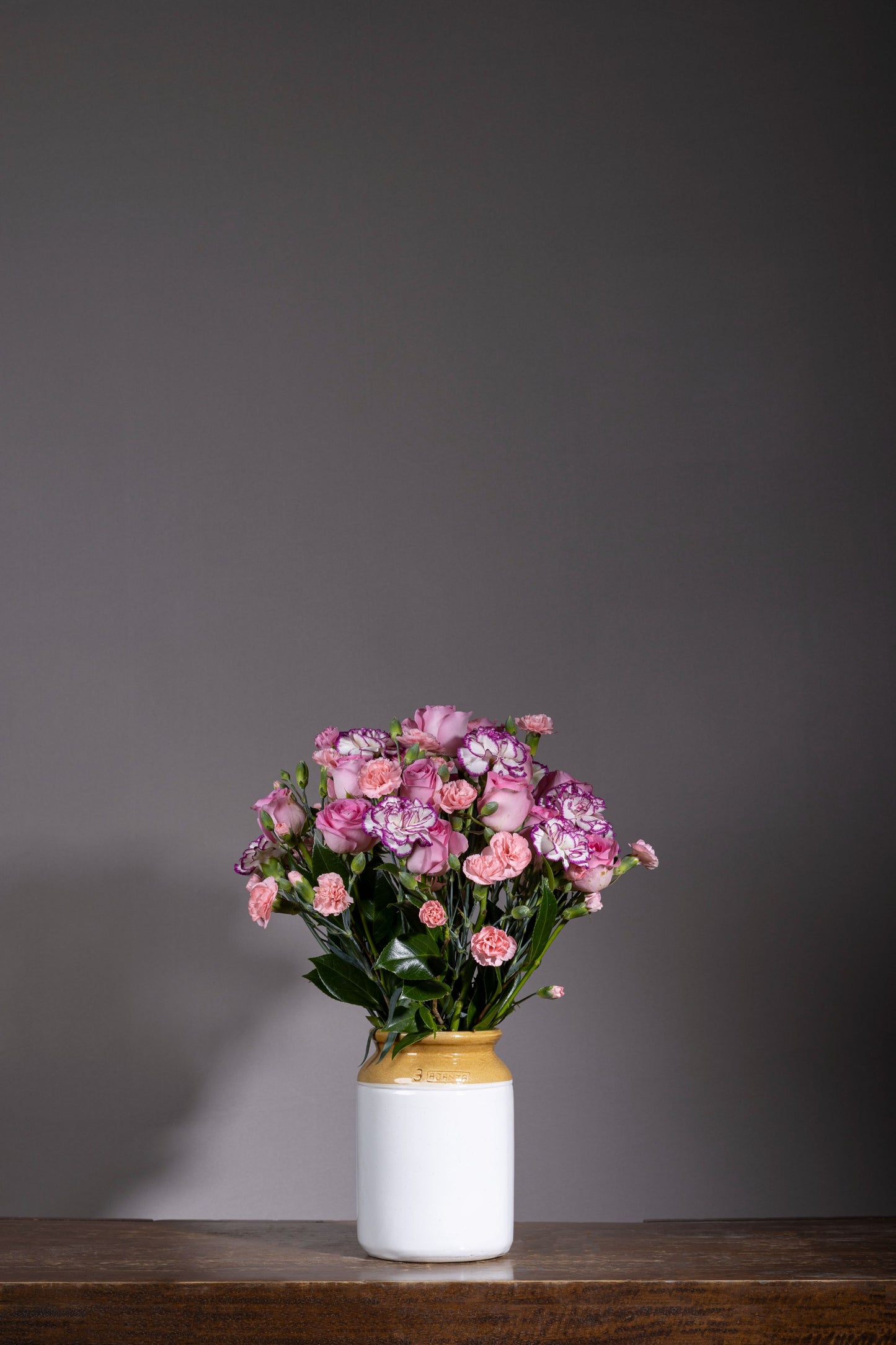 PINK SHOWERS | Beautiful pink and purple spray roses and carnations in a pickle jar | Flower delivery in Bengaluru | Buy flower bouquets online Bengaluru | Same-day flower delivery Bengaluru | Online florist Bengaluru | Order flowers online Bengaluru | Luxury flower bouquet in Bengaluru