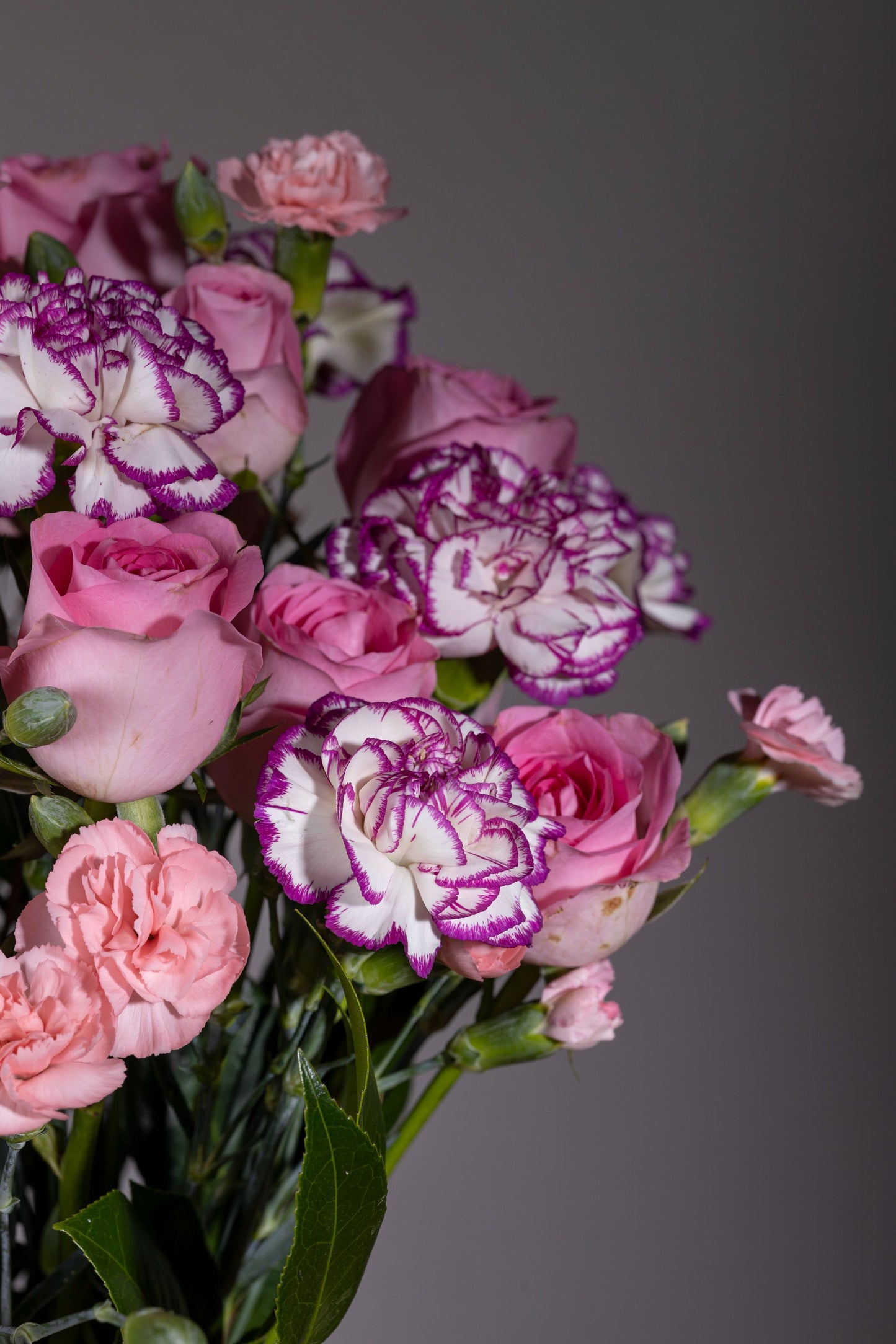 PINK SHOWERS | Beautiful pink and purple spray roses and carnations in a pickle jar | Flower delivery in Bengaluru | Buy flower bouquets online Bengaluru | Same-day flower delivery Bengaluru | Online florist Bengaluru | Order flowers online Bengaluru | Luxury flower bouquet in Bengaluru