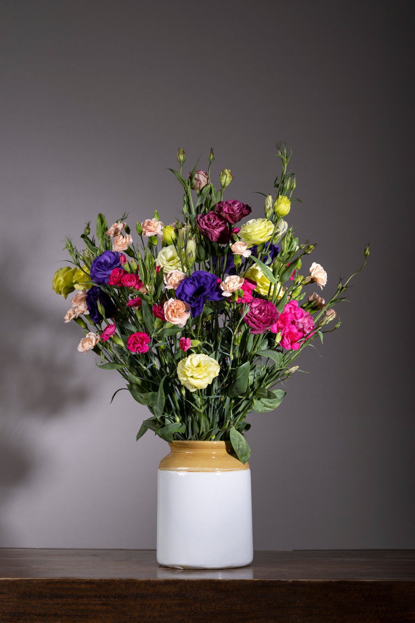 Joy of Colour – A custom blue powder-coated oval tin filled with vibrant pink Lisianthus flowers, Spray Carnation blossoms, and lush foliage, perfect for birthdays, anniversaries, thank you gifts, congratulations, and new baby celebrations. Flower delivery in Bengaluru | Buy flower bouquets online Bengaluru | Same-day flower delivery Bengaluru | Online florist Bengaluru | Order flowers online Bengaluru | Luxury flower bouquet in Bengaluru
