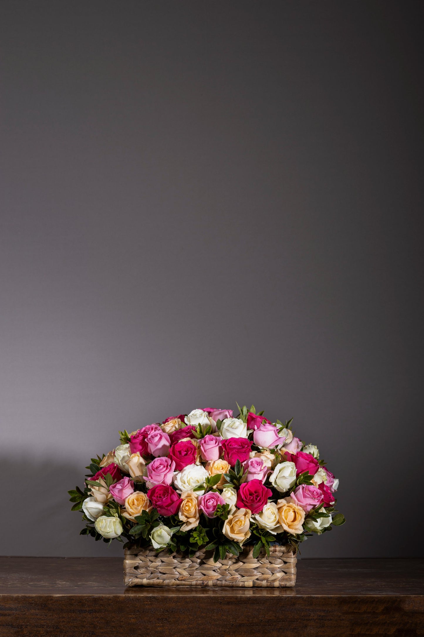 Peaceful Flower Basket – A stunning arrangement of red, pink, peach, and white roses, elegantly placed in a handcrafted upcycled hyacinth fiber basket. Perfect for birthdays, anniversaries, thank you gifts, congratulations, and new baby celebrations. Enjoy same-day flower delivery in Bengaluru from your trusted online florist in Bengaluru. Buy flower bouquets online in Bengaluru and experience the beauty of luxury flower bouquets in Bengaluru. Order flowers online in Bengaluru for any special occasion!