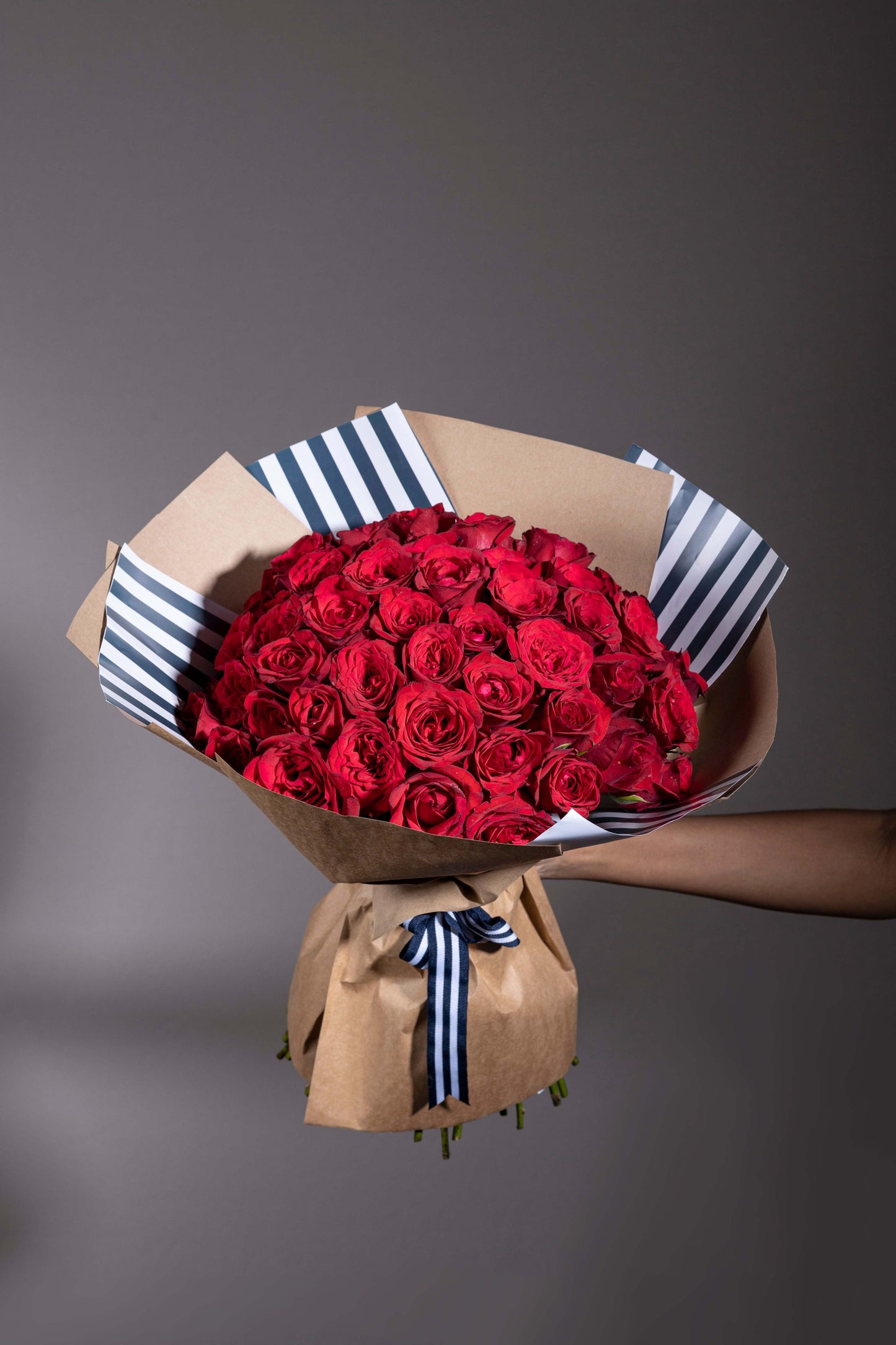 Sparks of Love – A stunning hand-tied bouquet of fresh red roses, elegantly wrapped in our custom wrapping paper. Perfect for birthdays, anniversaries, thank you gifts, congratulations, and new baby celebrations. Enjoy same-day flower delivery in Bengaluru from your trusted online florist in Bengaluru. Buy flower bouquets online in Bengaluru and experience the charm of a luxury flower bouquet in Bengaluru. Order flowers online in Bengaluru to make every occasion special