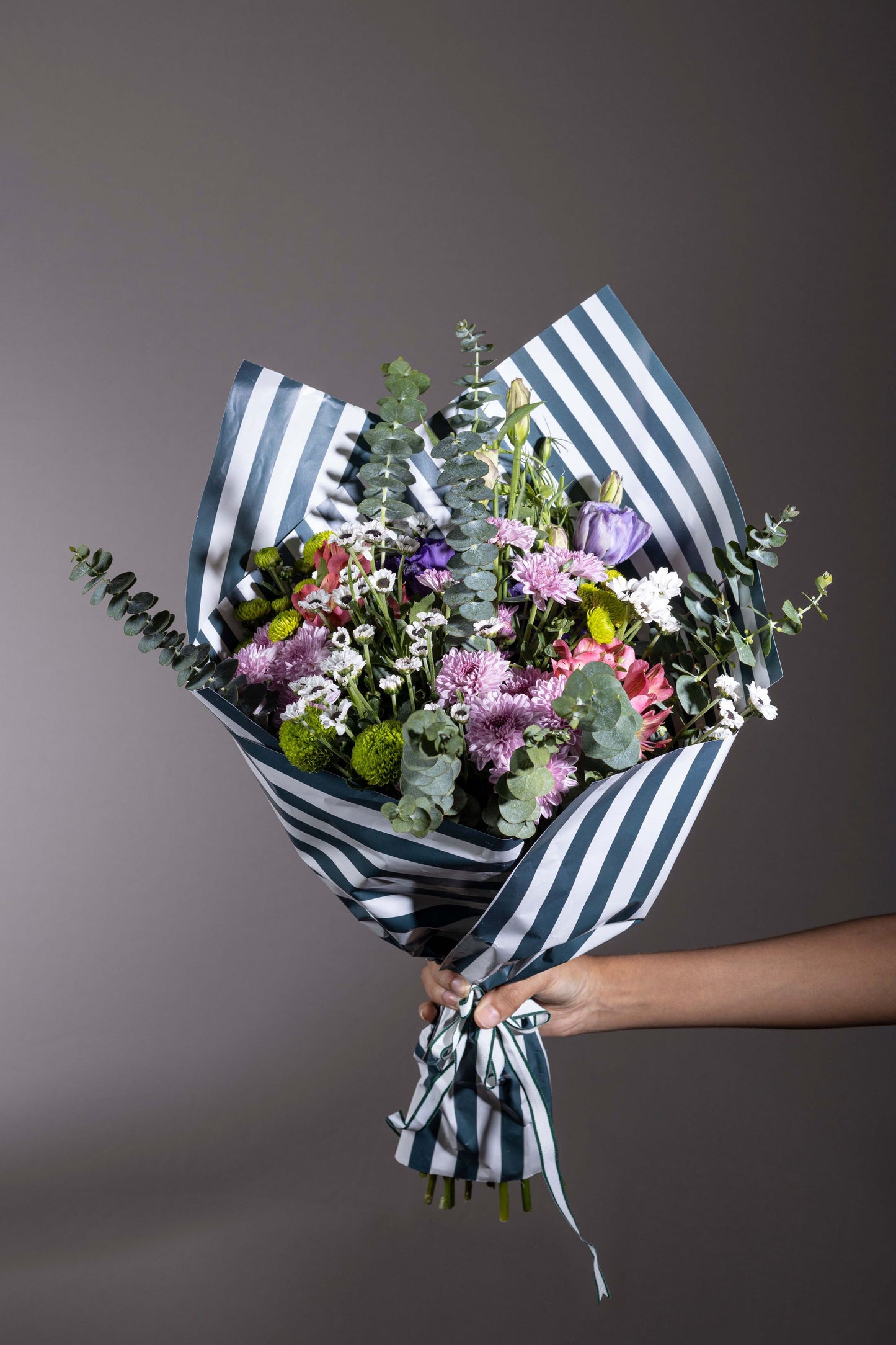 Misty Beauty - Mixed color spring flower bouquet in custom contemporary wrapping paper | Flower delivery in Bengaluru | Buy flower bouquets online in Bengaluru | Same-day flower delivery Bengaluru | Online florist Bengaluru | Order flowers online Bengaluru | Luxury flower bouquet in Bengaluru