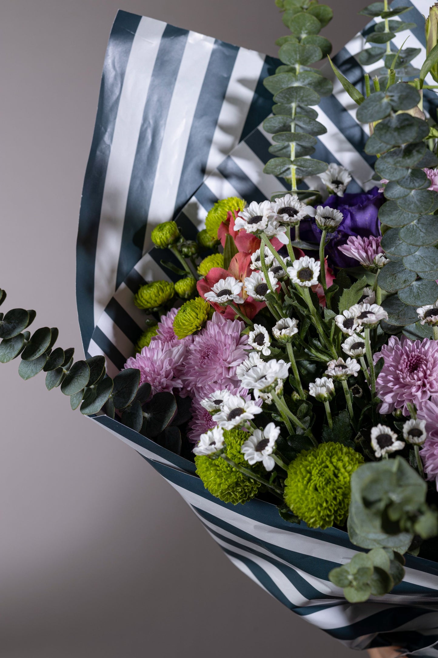 Misty Beauty - Mixed color spring flower bouquet in custom contemporary wrapping paper | Flower delivery in Bengaluru | Buy flower bouquets online in Bengaluru | Same-day flower delivery Bengaluru | Online florist Bengaluru | Order flowers online Bengaluru | Luxury flower bouquet in Bengaluru