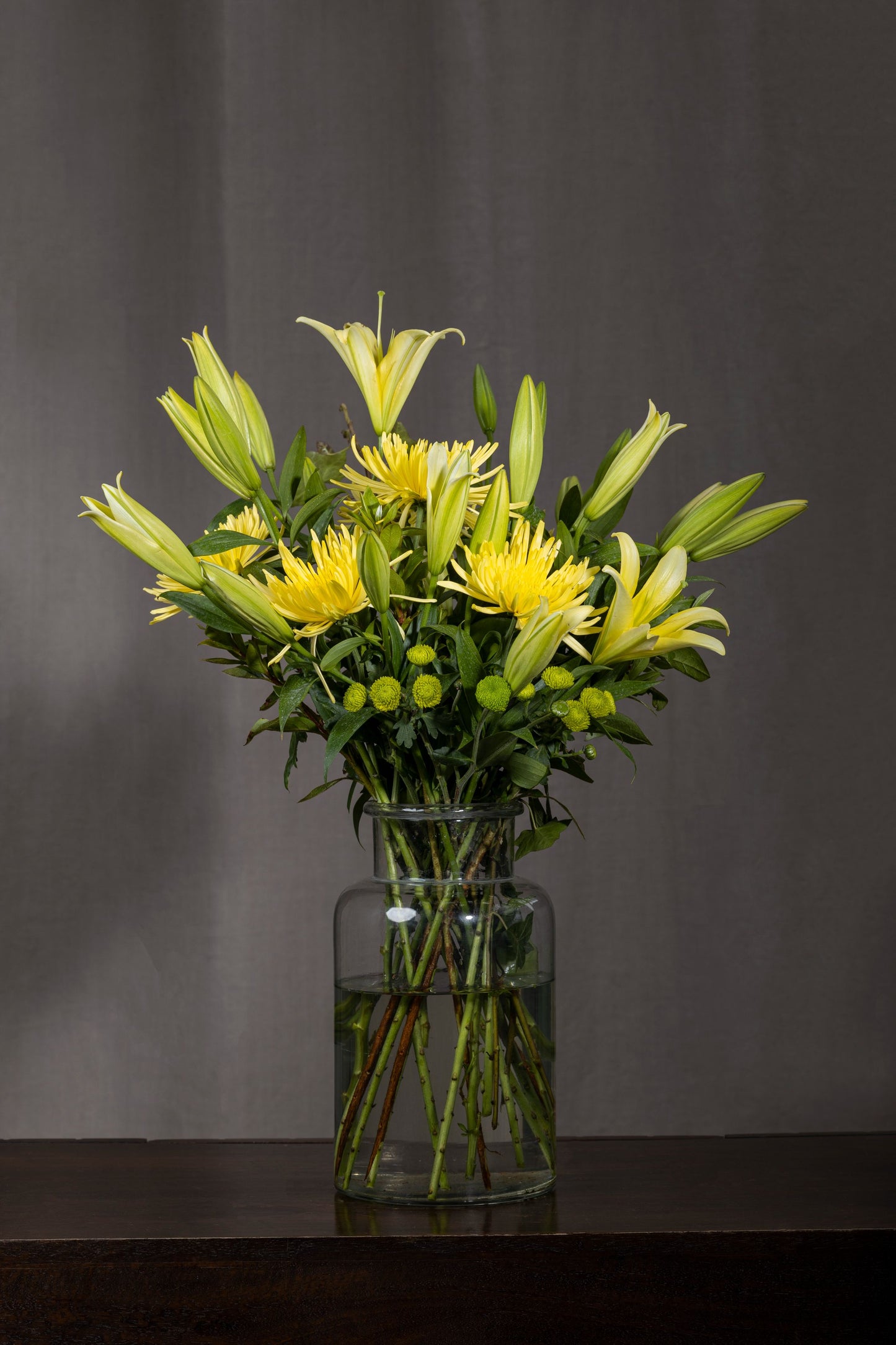 Sun Drenched - A radiant bouquet featuring yellow Oriental Lilies, large Chrysanthemum flowers, and green Chrysanthemum buds | Flower delivery in Bengaluru | Buy flower bouquets online Bengaluru | Same-day flower delivery Bengaluru | Online florist Bengaluru | Order flowers online Bengaluru | Luxury flower bouquet in Bengaluru