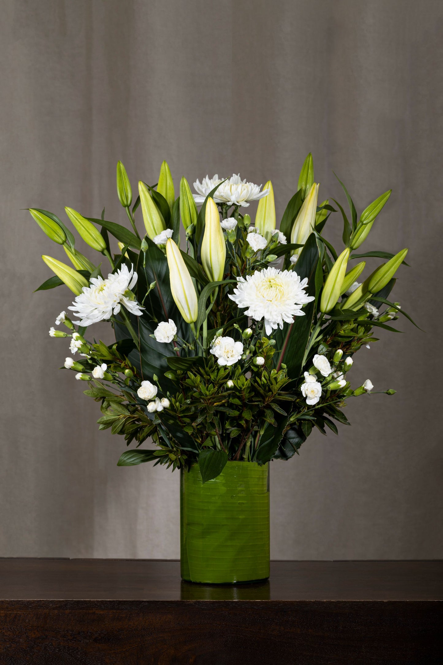 Nostalgia - Elegant glass vase with White Oriental Lilies, Disbuds White Chrysanthemum, and White Spray Carnation flowers | Flower delivery in Bengaluru | Buy flower bouquets online Bengaluru | Same-day flower delivery Bengaluru | Online florist Bengaluru | Order flowers online Bengaluru | Luxury flower bouquet in Bengaluru