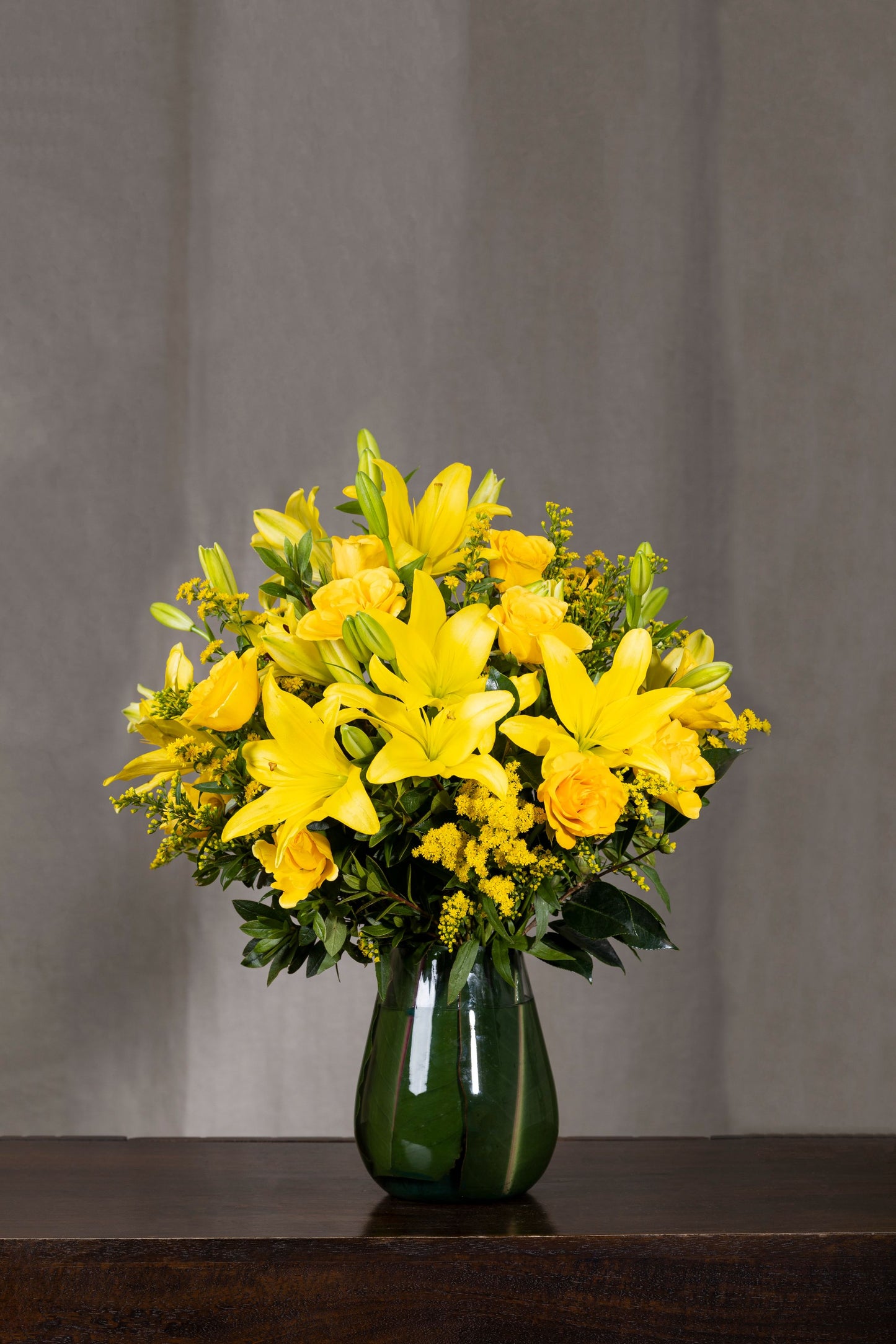 Yellow Mellow - A vibrant medley of Asiatic Lilies with matching fillers in a lovely oval glass vase | Flower delivery in Bengaluru | Buy flower bouquets online Bengaluru | Same-day flower delivery Bengaluru | Online florist Bengaluru | Order flowers online Bengaluru | Luxury flower bouquet in Bengaluru