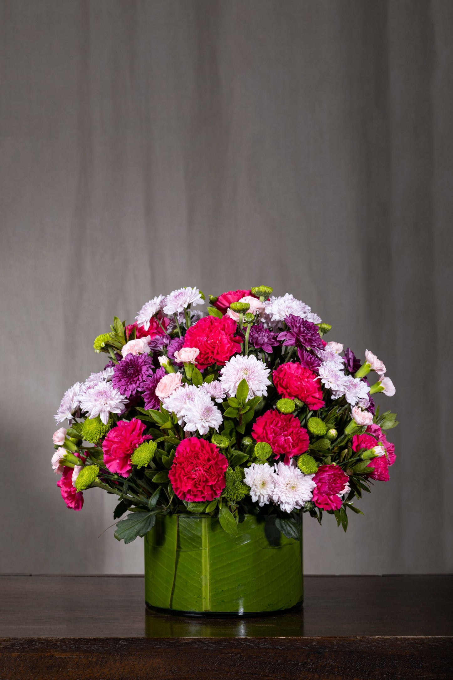 GENTLE GLOW - A harmonious blend of Red Carnations and White Chrysanthemums in a serene floral arrangement. Perfect for Birthdays, Anniversaries, Thank You, Congratulations, New Baby, and Condolence. Flower delivery in Bengaluru, Buy flower bouquets online Bengaluru, Same-day flower delivery Bengaluru, Online florist Bengaluru, Order flowers online Bengaluru, Luxury flower bouquet in Bengaluru