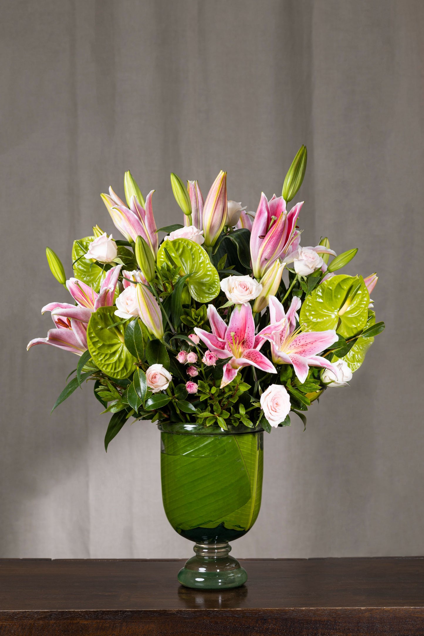OHANA SIGNATURE - A signature floral arrangement featuring fresh and fragrant pink Oriental Lilies, Green Anthuriums, and Spray Carnations. Perfect for Birthdays, Anniversaries, Thank You, Congratulations, New Baby, and Condolence. Flower delivery in Bengaluru, Buy flower bouquets online Bengaluru, Same-day flower delivery Bengaluru, Online florist Bengaluru, Order flowers online Bengaluru, Luxury flower bouquet in Bengaluru
