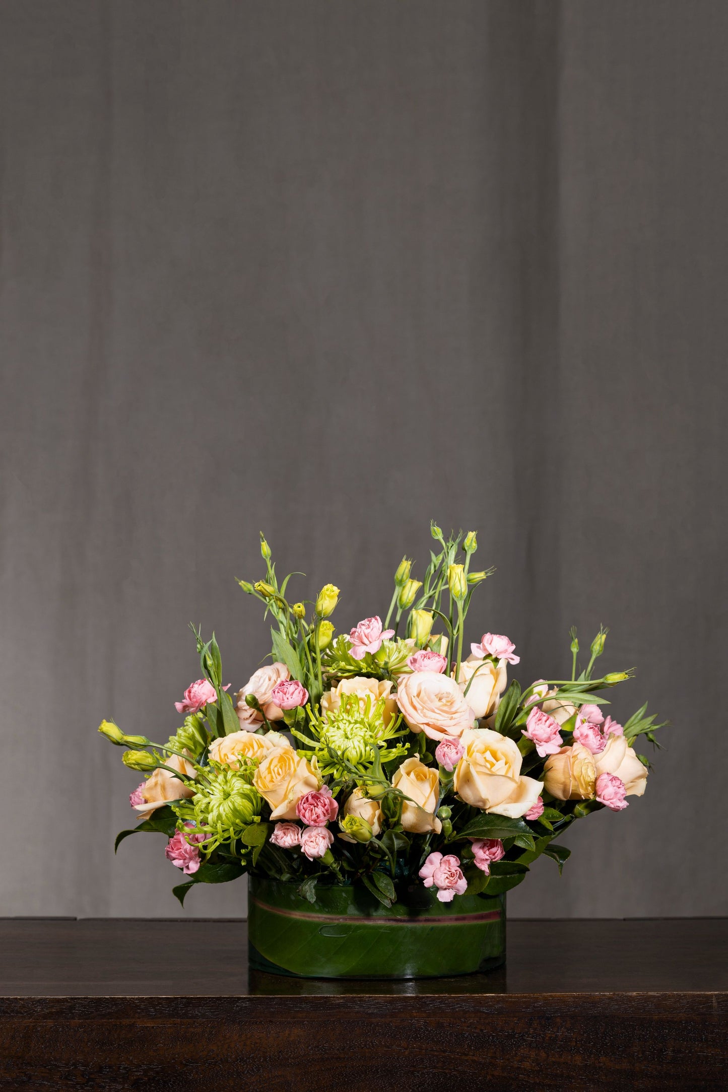 PEACH BONANZA - A stunning floral arrangement featuring mixed-color Lisianthus blooms blended with Spray Carnation flowers in a glass container. Perfect for Birthdays, Anniversaries, Thank You, Congratulations, New Baby, and Condolence. Flower delivery in Bengaluru, Buy flower bouquets online Bengaluru, Same-day flower delivery Bengaluru, Online florist Bengaluru, Order flowers online Bengaluru, Luxury flower bouquet in Bengaluru