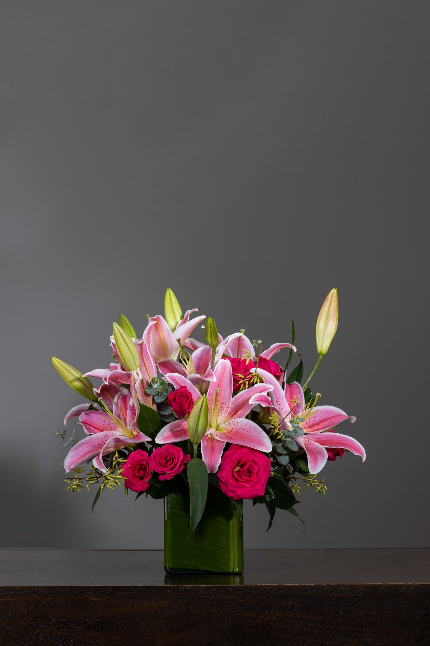 SCENT OF LOVE - A mesmerizing floral arrangement of fragrant pink Oriental Lilies and delicate Pink Carnation stems elegantly placed in a sleek glass container. Perfect for Birthdays, Anniversaries, Thank You, Congratulations, and New Baby. Flower delivery in Bengaluru, Buy flower bouquets online in Bengaluru, Same-day flower delivery Bengaluru, Online florist Bengaluru, Order flowers online Bengaluru, Luxury flower bouquet in Bengaluru