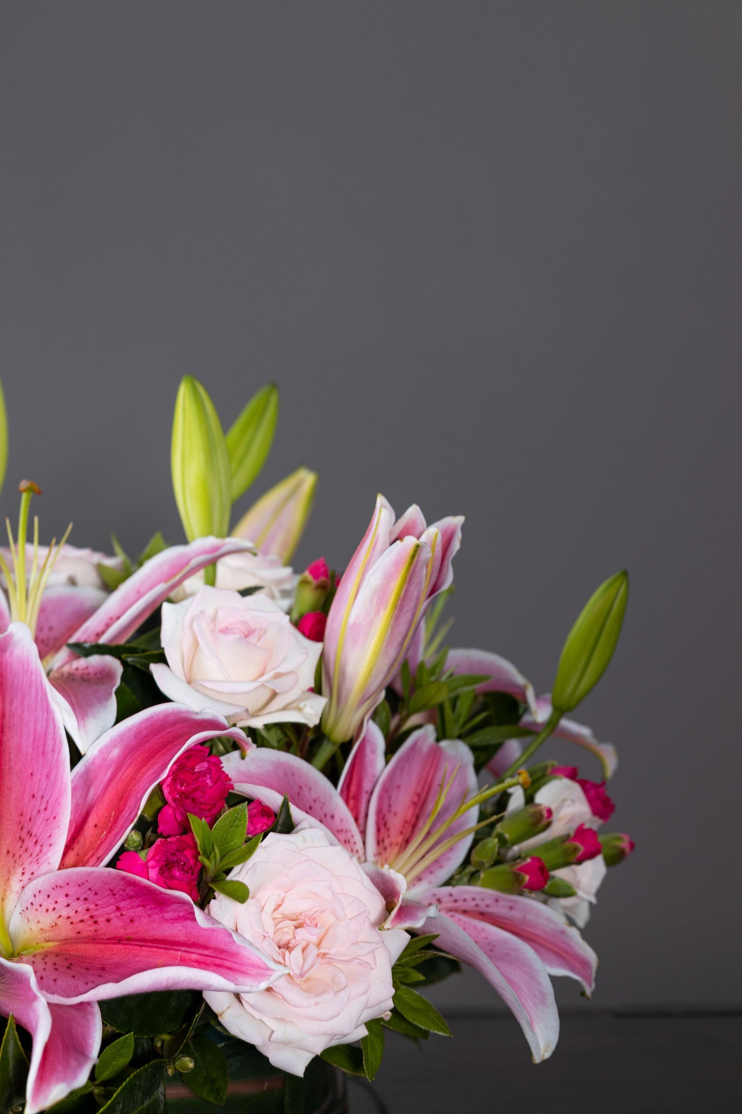 PERFUMERY - A delightful floral arrangement featuring aromatic pink Oriental Lilies complemented by White Carnation blossoms in an elegant glass container. Perfect for Birthdays, Anniversaries, Thank You, Congratulations, New Baby, and Condolence. Flower delivery in Bengaluru, Buy flower bouquets online in Bengaluru, Same-day flower delivery Bengaluru, Online florist Bengaluru, Order flowers online Bengaluru, Luxury flower bouquet in Bengaluru