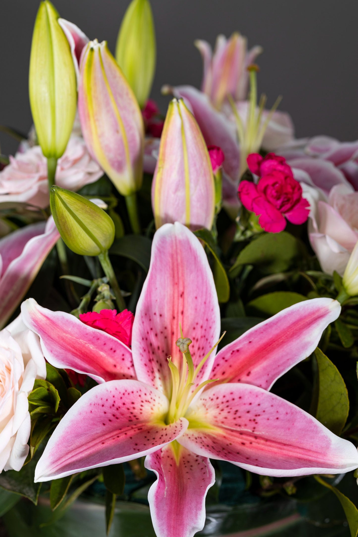 PERFUMERY - A delightful floral arrangement featuring aromatic pink Oriental Lilies complemented by White Carnation blossoms in an elegant glass container. Perfect for Birthdays, Anniversaries, Thank You, Congratulations, New Baby, and Condolence. Flower delivery in Bengaluru, Buy flower bouquets online in Bengaluru, Same-day flower delivery Bengaluru, Online florist Bengaluru, Order flowers online Bengaluru, Luxury flower bouquet in Bengaluru