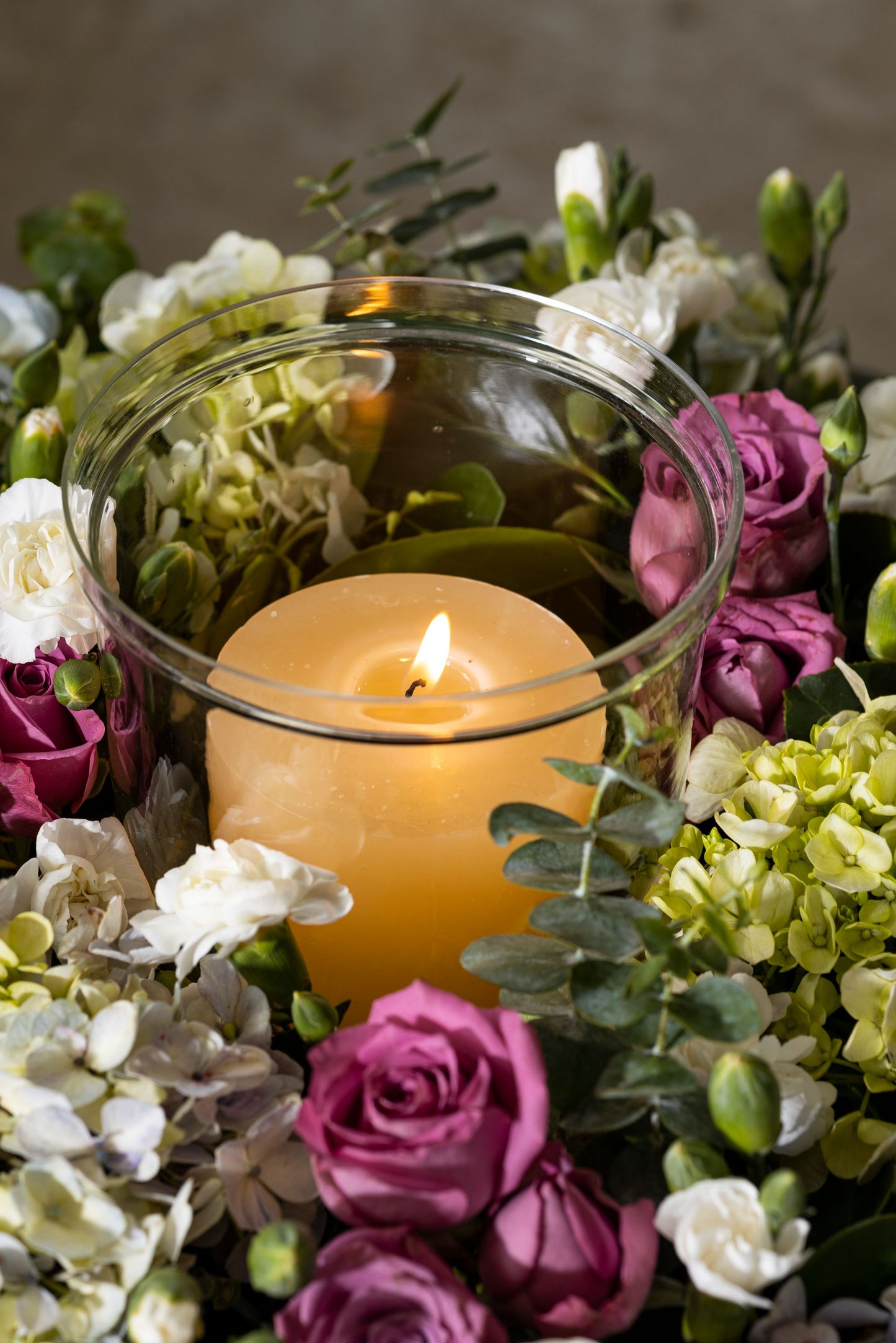 CIRCLE OF LIFE - A stunning floral wreath adorned with Hydrangea bunches, Roses, and a central candle, creating an elegant circle of life theme for any special dinner. Perfect for Birthdays, Anniversaries, Thank You, Congratulations, New Baby, and Condolence. Flower delivery in Bengaluru, Buy flower bouquets online in Bengaluru, Same-day flower delivery Bengaluru, Online florist Bengaluru, Order flowers online Bengaluru, Luxury flower bouquet in Bengaluru