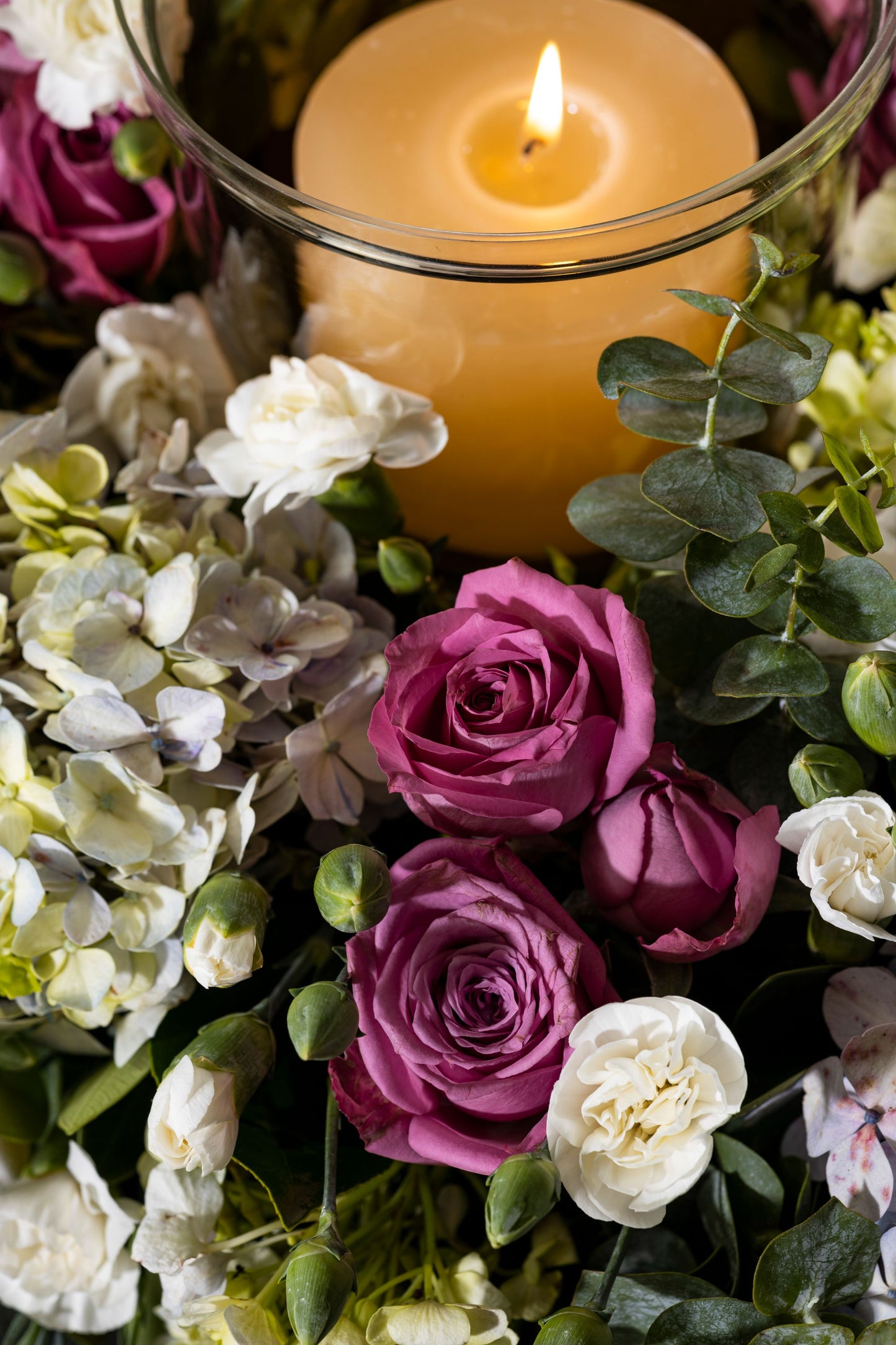 CIRCLE OF LIFE - A stunning floral wreath adorned with Hydrangea bunches, Roses, and a central candle, creating an elegant circle of life theme for any special dinner. Perfect for Birthdays, Anniversaries, Thank You, Congratulations, New Baby, and Condolence. Flower delivery in Bengaluru, Buy flower bouquets online in Bengaluru, Same-day flower delivery Bengaluru, Online florist Bengaluru, Order flowers online Bengaluru, Luxury flower bouquet in Bengaluru