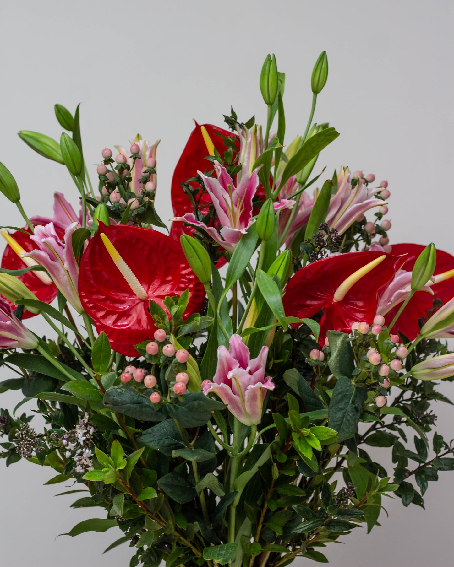 My Heart Will Go On – A stunning glass container with intricate details, symbolizing everlasting love. Featuring vibrant Red Anthurium, Pink Oriental Lilies, delicate Pink Berries, and lush green fillers, perfect for Valentine’s Day, birthdays, anniversaries, congratulations, new baby celebrations, and thank you gifts. Flower delivery in Bengaluru | Buy flower bouquets online Bengaluru | Same-day flower delivery Bengaluru | Online florist Bengaluru | Order flowers online Bengaluru