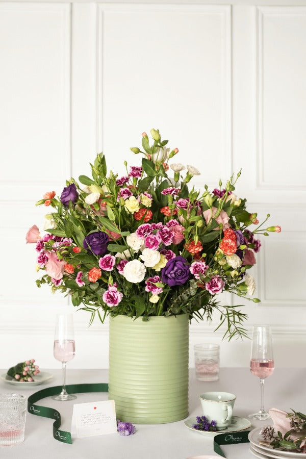 Vibrant mixed flower arrangement in a decorative tin – a perfect gift for Valentine’s Day, featuring a stunning blend of colors and floral varieties